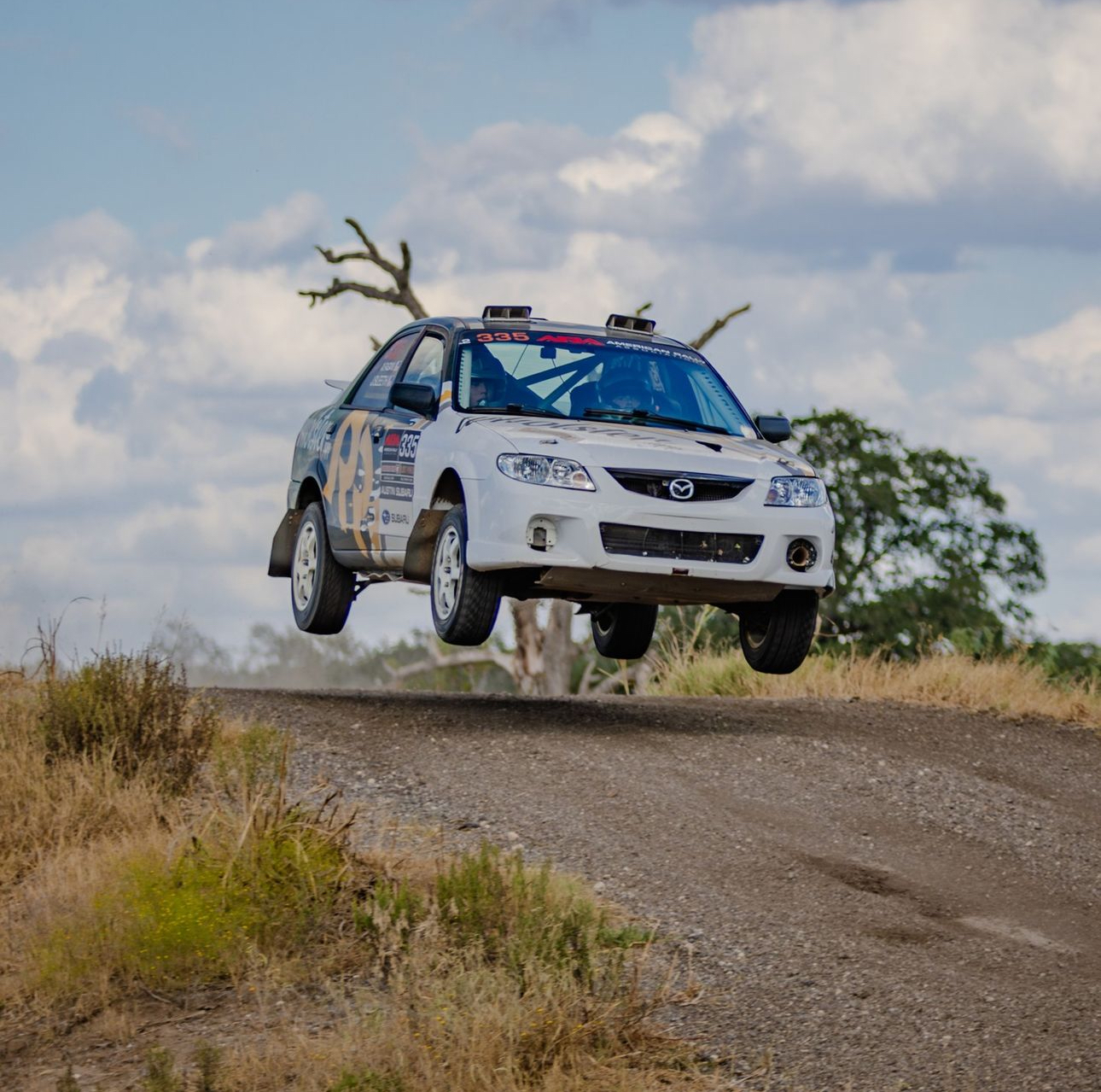 Jarred Sleeth's Wholster rally car jumping on a rally stage